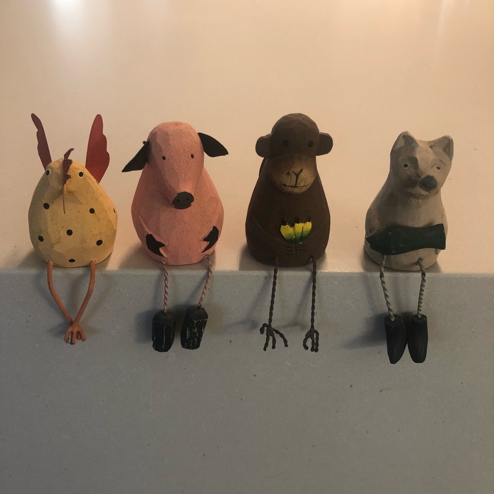 4 carved painted wood animals with metal detail.